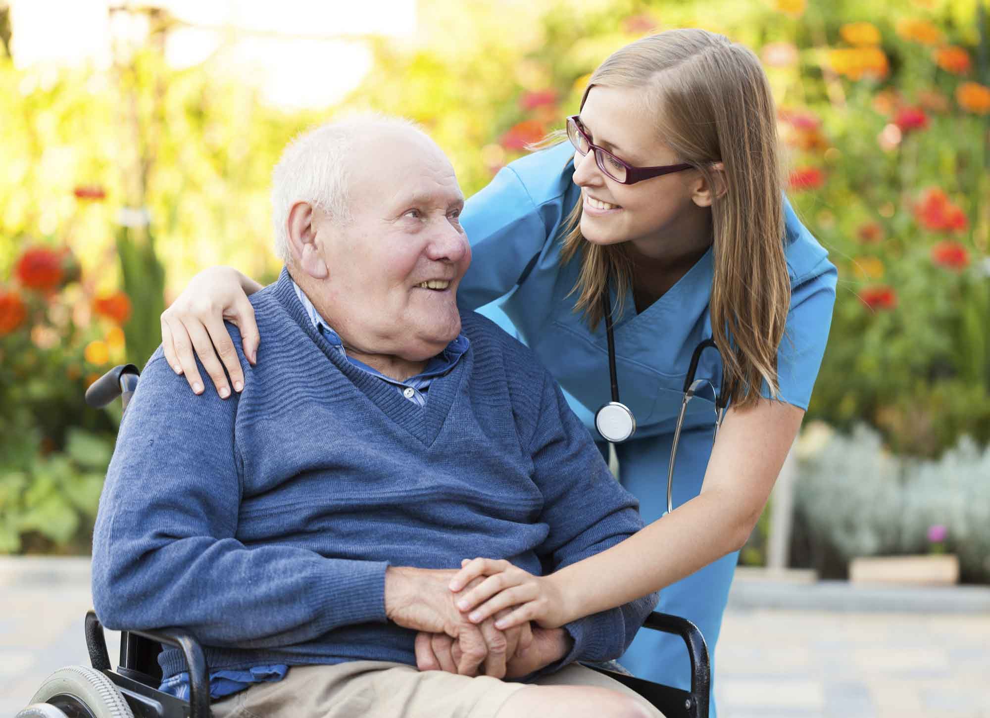 Medical professional helping an older man