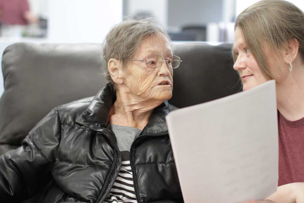 Smiling Horizon nursing staff treating client.